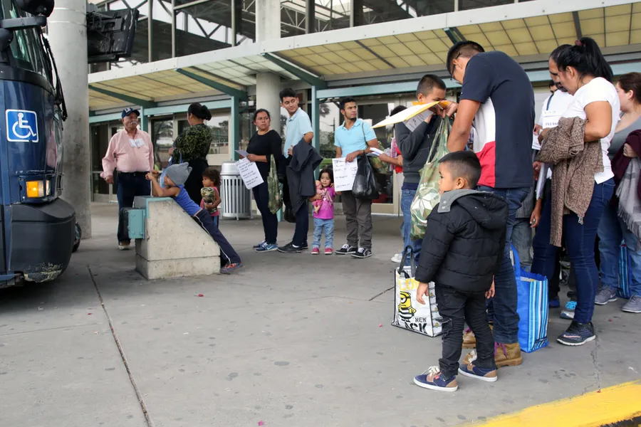April 17, 2019: Central American migrants seeking asylum line up at the bus station in McAllen, Texas to go stay with their sponsors?w=200&h=150